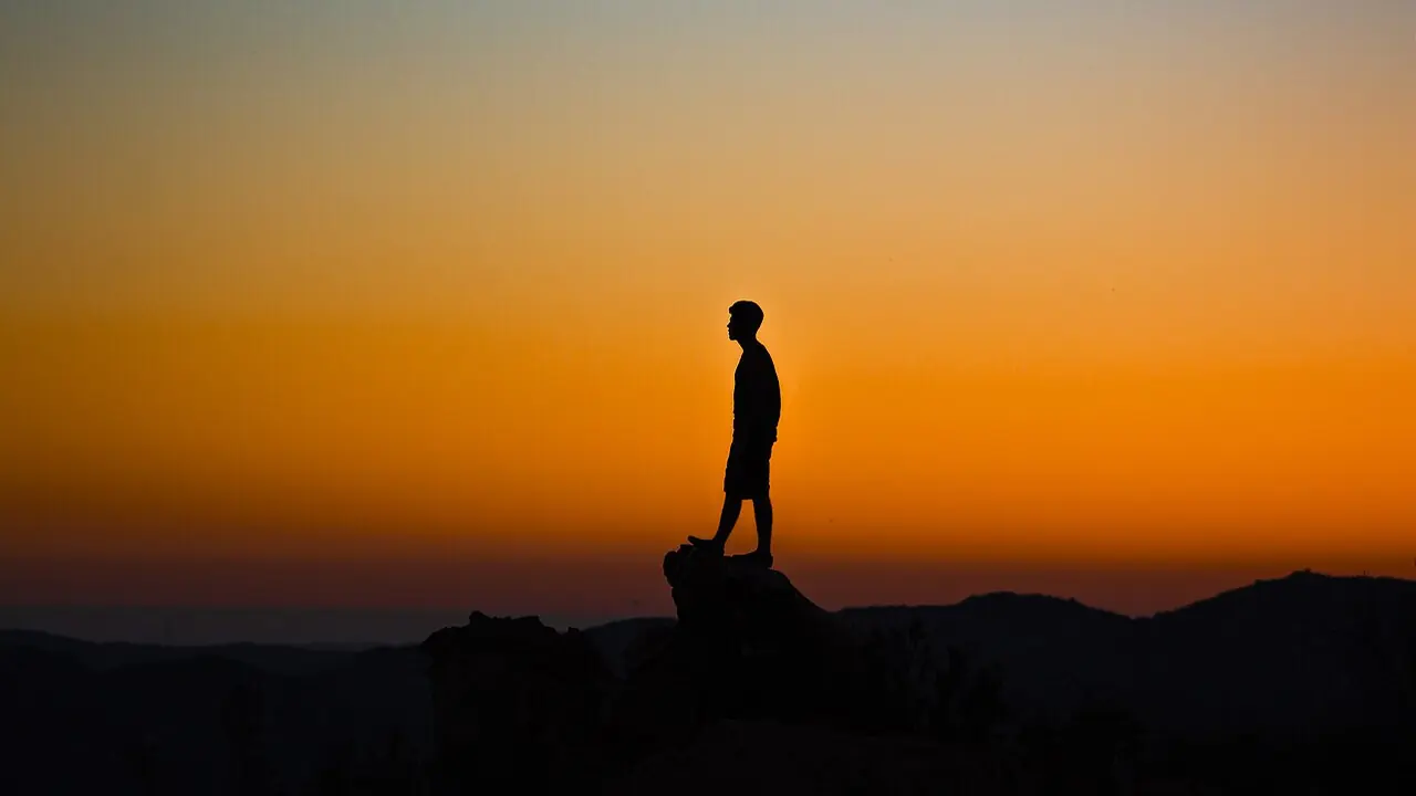 Hiker silhouette at sunset in El Cajon